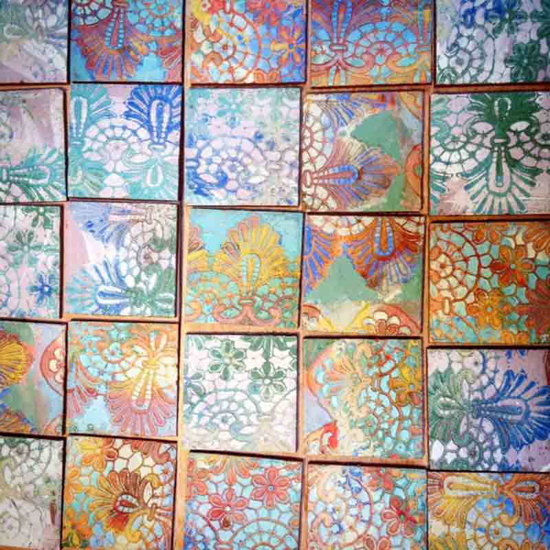 clay tiles decorated with lace resist glaze in a ceramics workshop in wiltshire uk